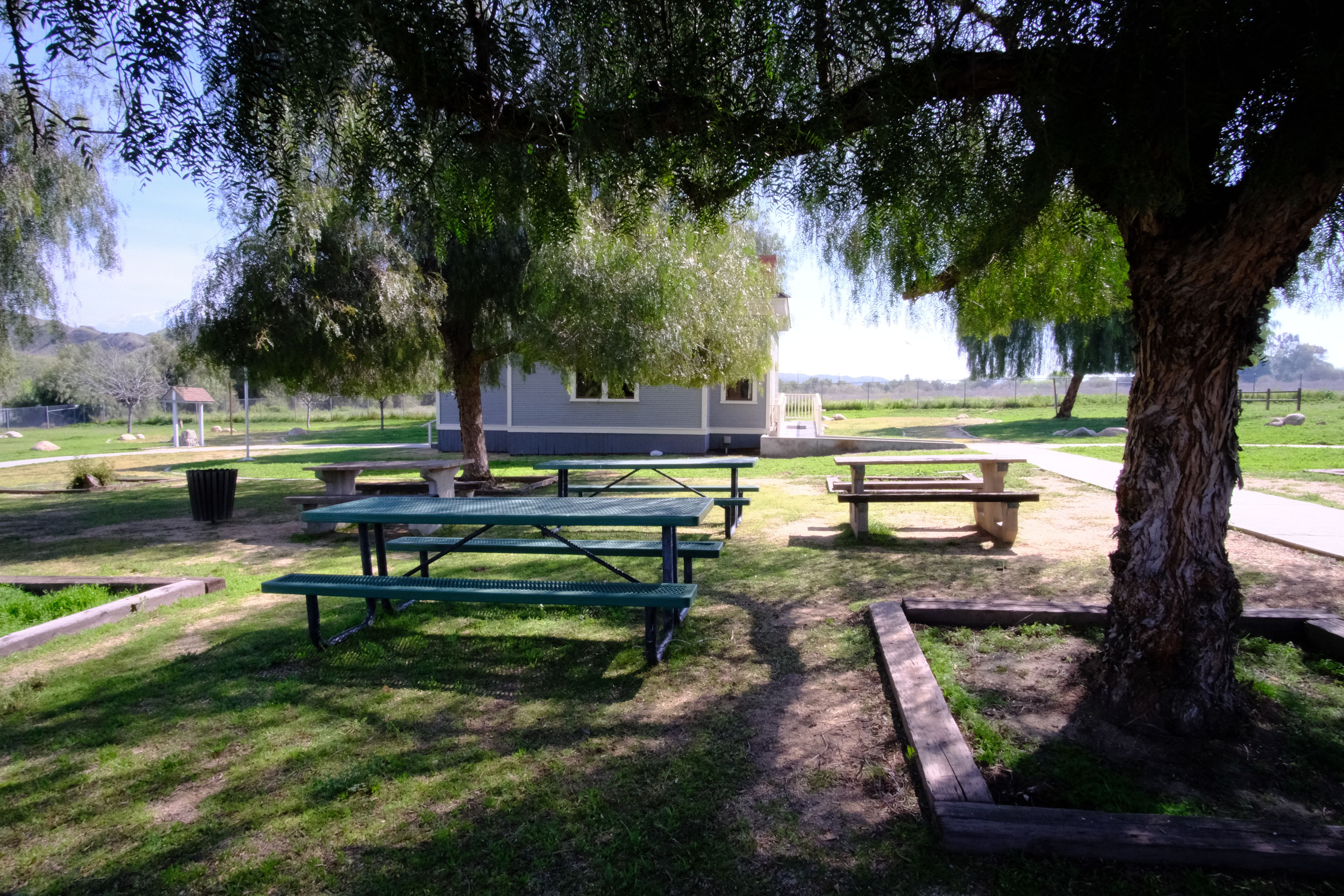 Picnic Benches in Front of Schoolhouse