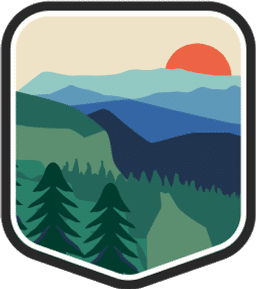 An illustrated badge for the Tennessee community depicting a mountain landscape with a valley and a clear sky.