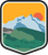 An illustrated badge for the Alaska community featuring a vast mountain range with snow-capped peaks with the sun setting behind the range.