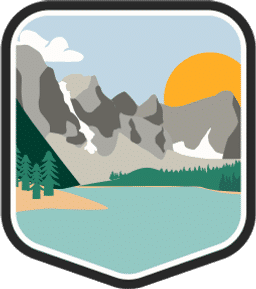 An illustrated badge for the Alberta community of a mountain range with rugged peaks, partially covered in snow, with trees in the foreground.