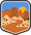An illustrated badge for the Arizona community depicting a desert scene with red rock formations under a vibrant blue sky.