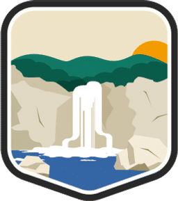 An illustrated badge for the Arkansas community featuring a tall rock formation with a waterfall, set against a backdrop of forested hills.