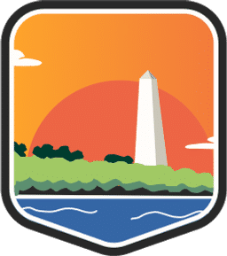 An illustrated badge for the District of Columbia community showing the Washington Monument in front of a sunset with a riverfront and trees.