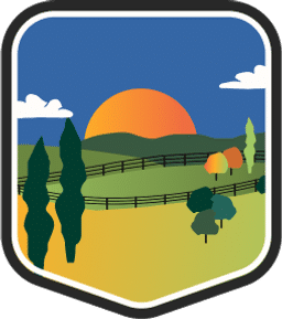 An illustrated badge for the Kentucky community depicting fields surrounded by fences with tall trees under a dark blue sky.