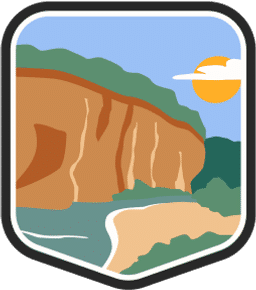 An illustrated badge for the Missouri community depicting a rock formation under a blue sky.