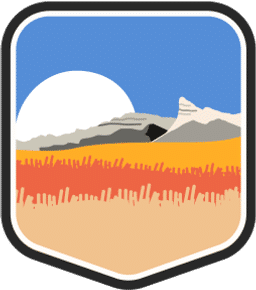 An illustrated badge for the Nebraska community showing a prairie landscape with tall grasses and a wide-open sky.