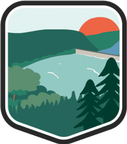 An illustrated badge for the Pennsylvania community depicting a forest with tall trees, a lake, and rolling hills under a blue sky.