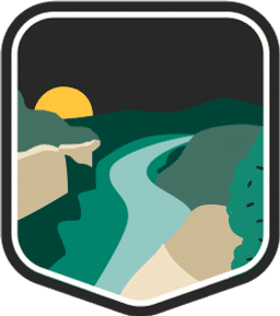 An illustrated badge for the West Virginia community depicting a river winding through a forested valley with mountains and a setting moon in the background.