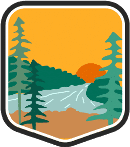 An illustrated badge for the Wisconsin community featuring a forested landscape with tall trees and a river under a setting sun.