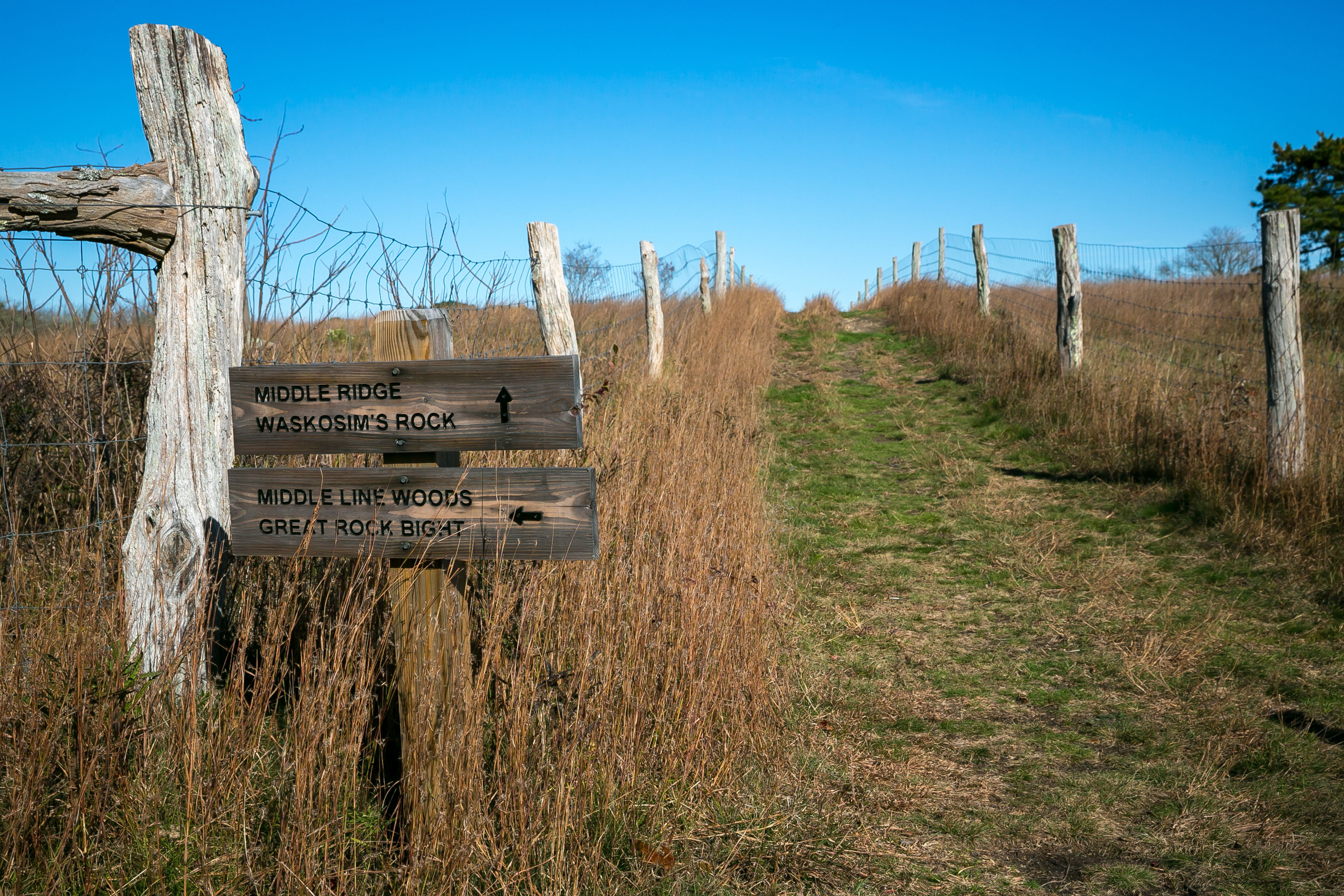 trail with signs to other properties