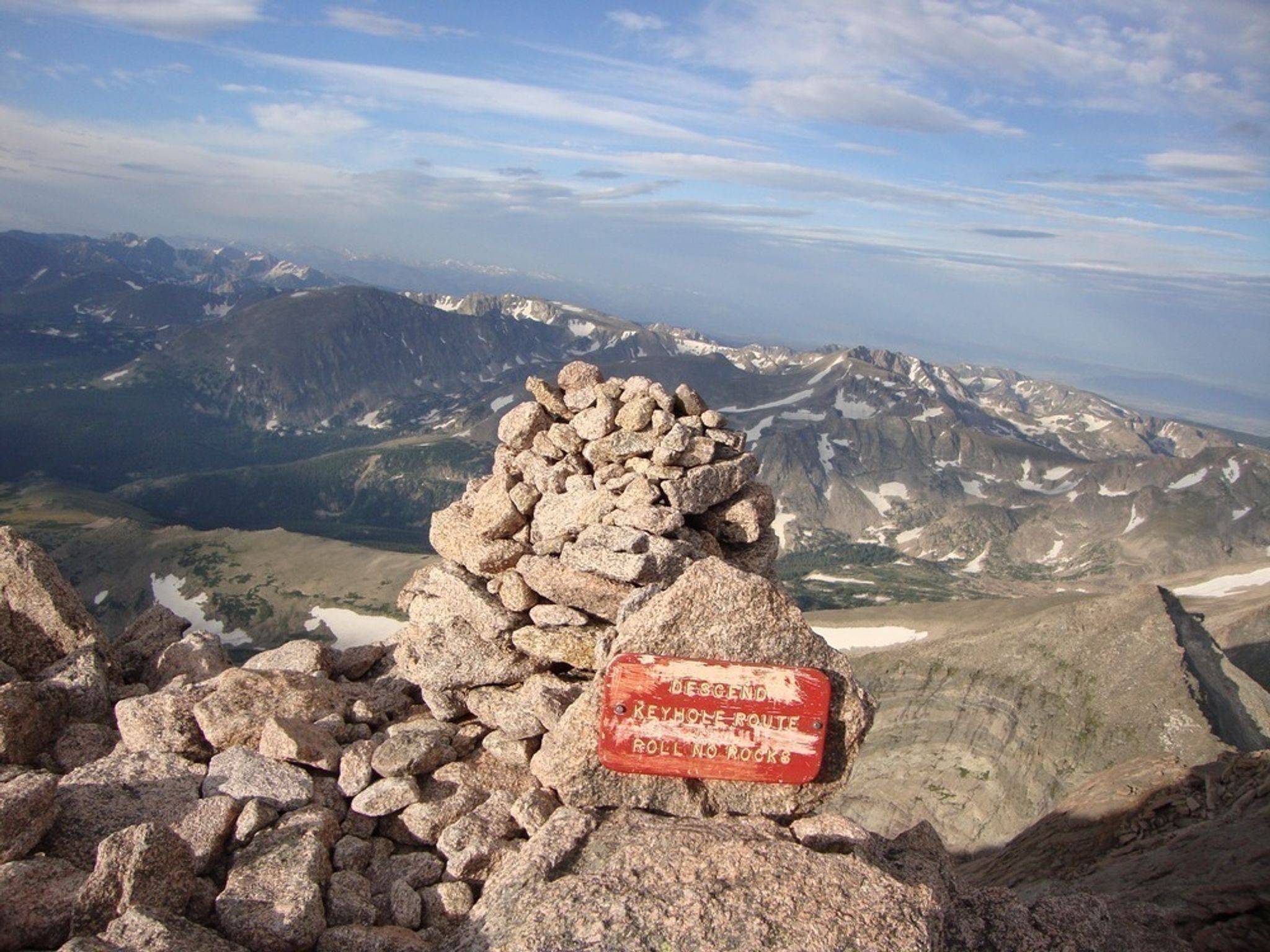 A photo of a sign beside a cairn going up the "Keyhole Route" on Longs Peak.