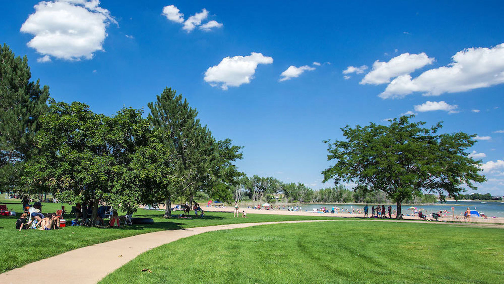 Photo of the swim beach at Boyd Lake State Park on a sunny day.