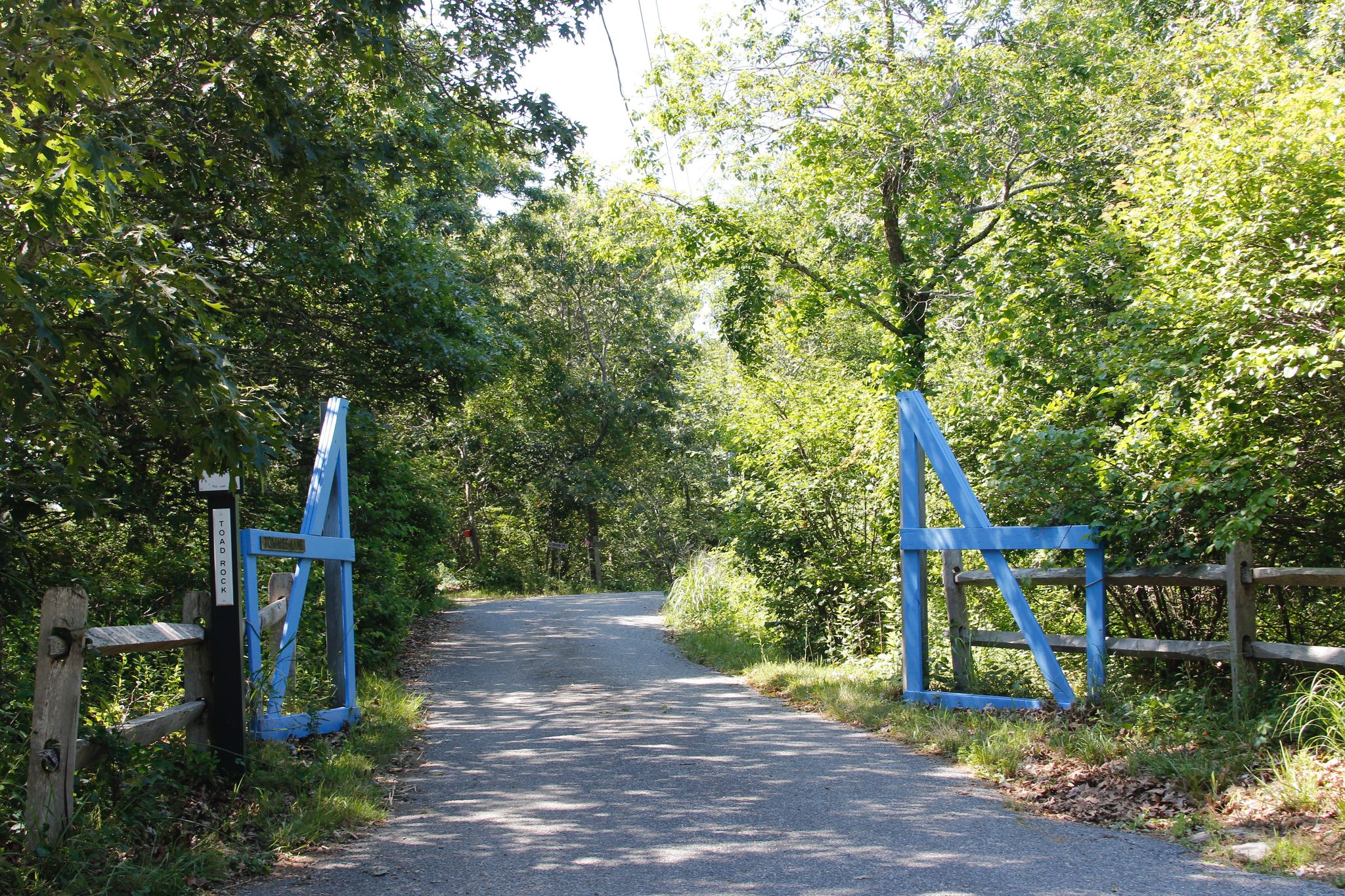 blue gates at Towhee Lane/Moshup Trail intersection