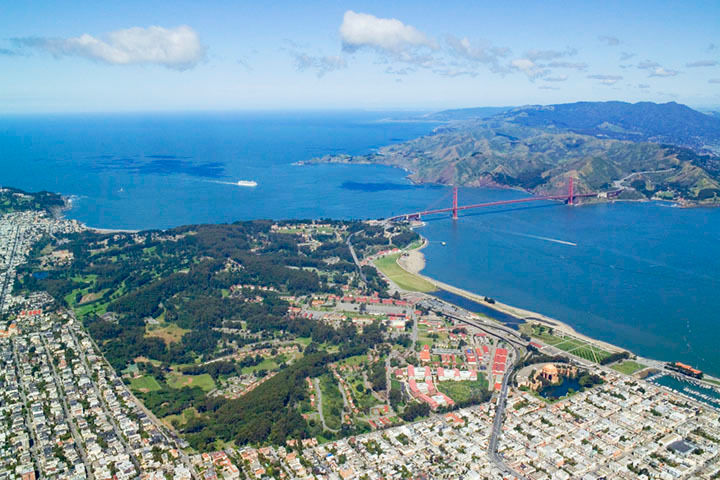 Aerial view of the Presidio of San Francisco, the Golden Gate and bridge, and the Marin Headlands and Mount Tamalpais (right background).