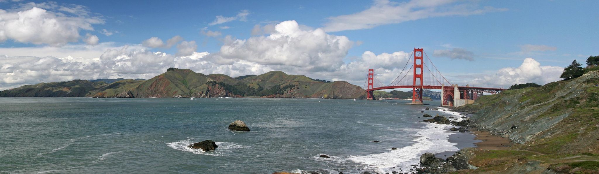Golden Gate Bridge from the Presidio with Marin Headlands in background.