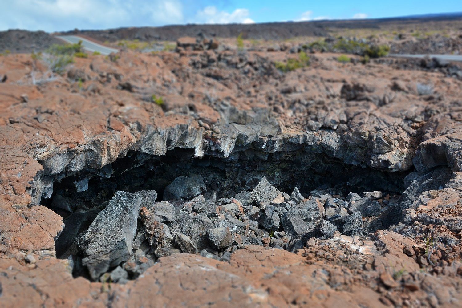 Lava tubes can be seen just off the road.