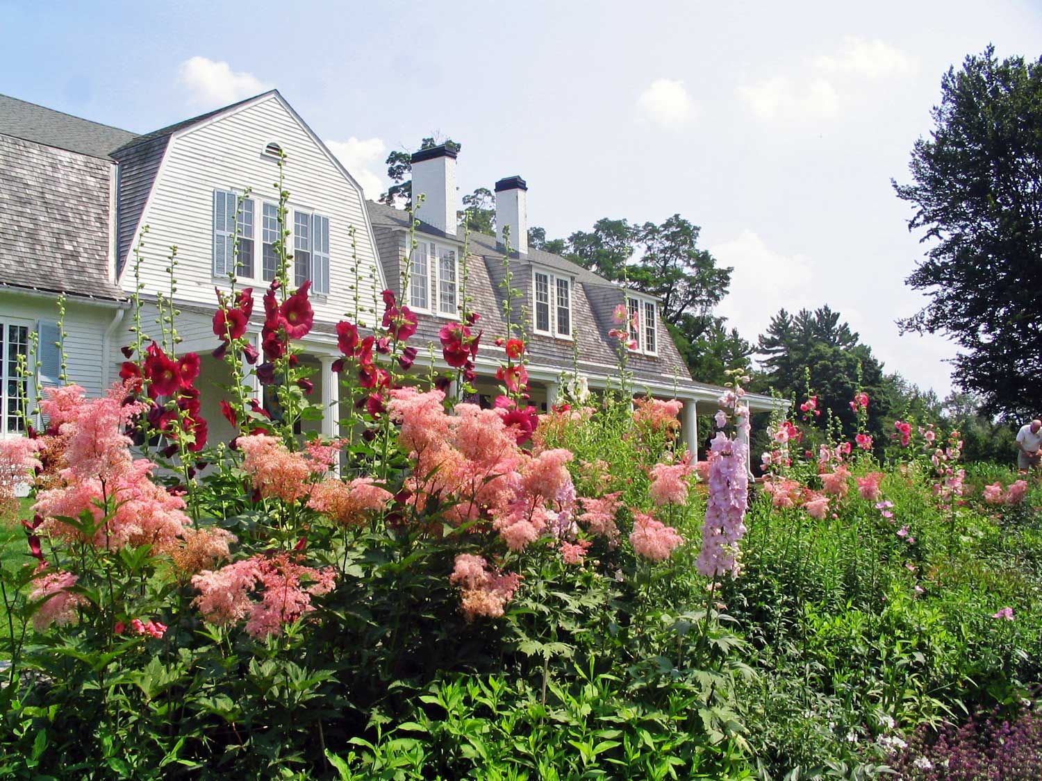 Flowers in many colors make up the gardens in front of the John Hay Estate at The Fells.