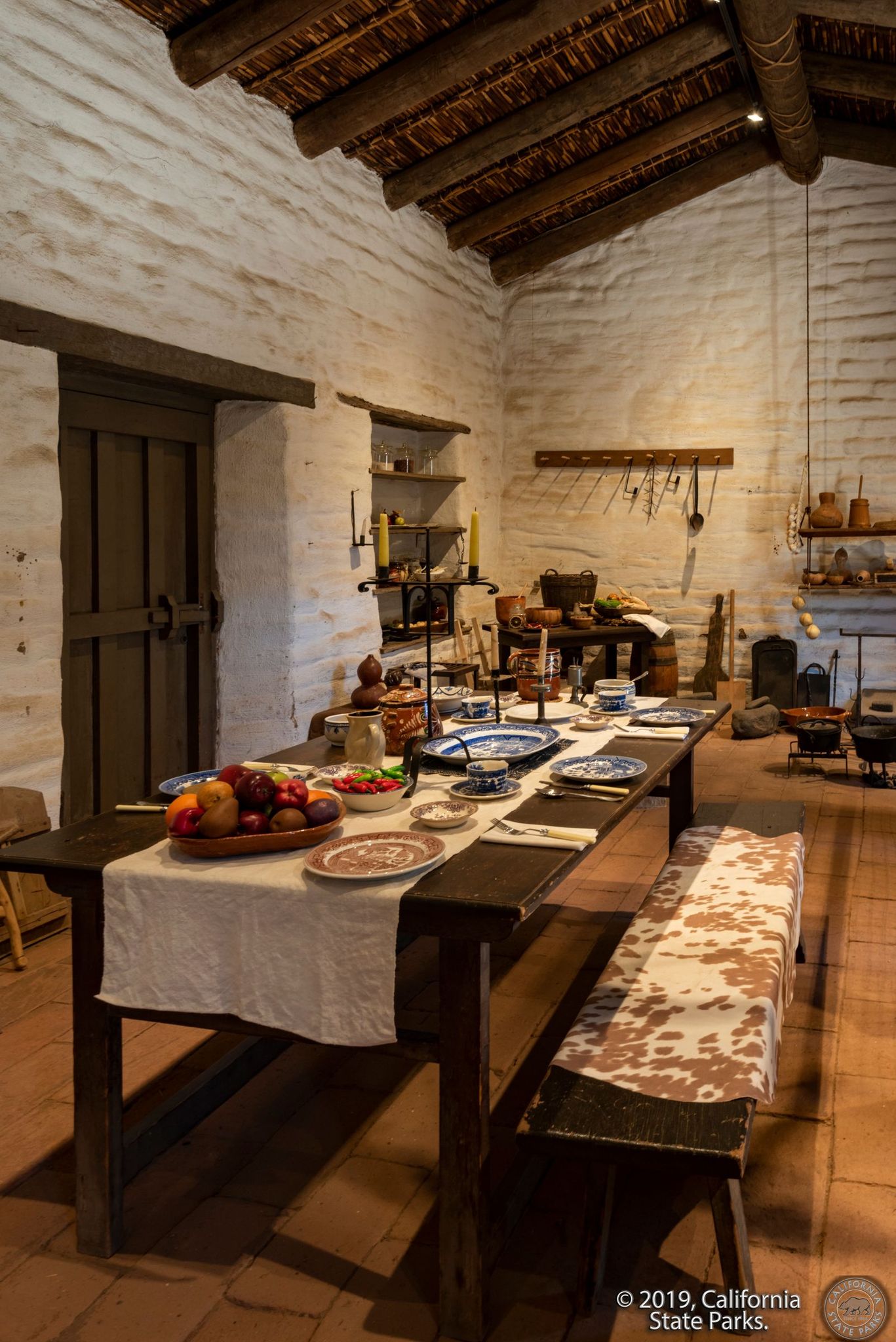 Photo of the interior of La Casa de Machado y Stewart Museum, showing the dining room table set for a meal.