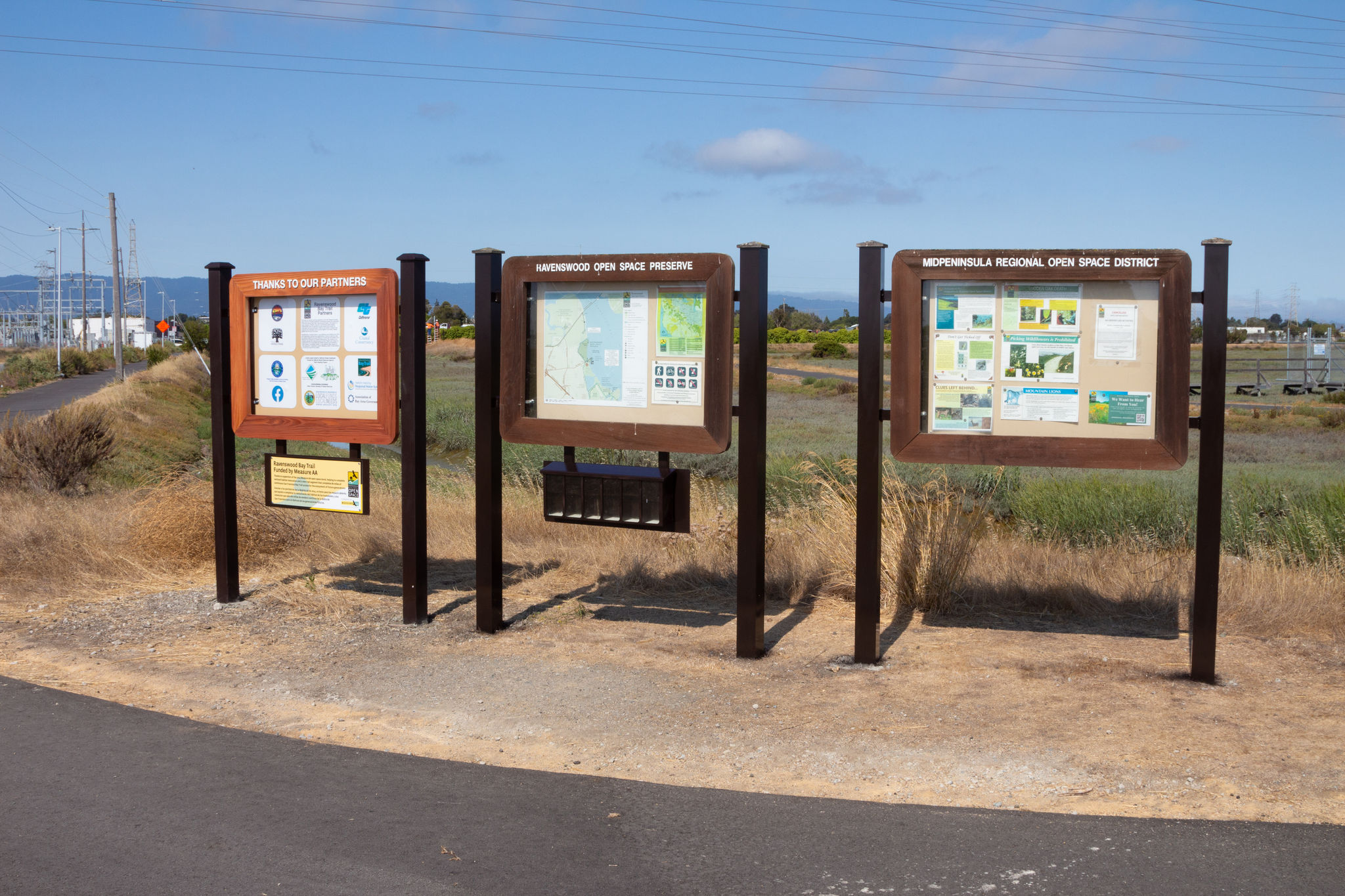 Signboards by the parking lot at Ravenswood Open Space Preserve. 