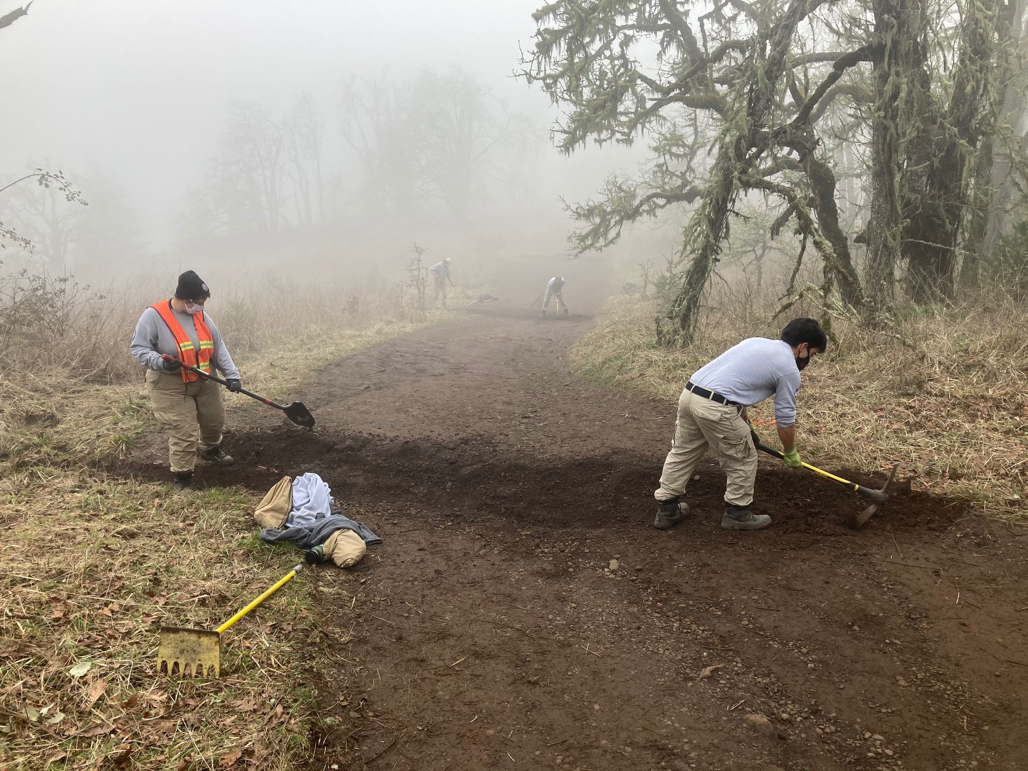 NCCC crew members work to construct rolling dips on upper Trail 1