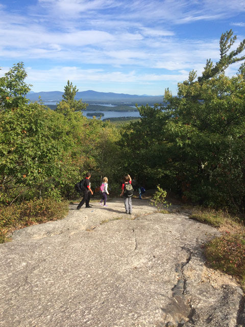 Three pint-sized hikers stop on the ledges to take in the views.