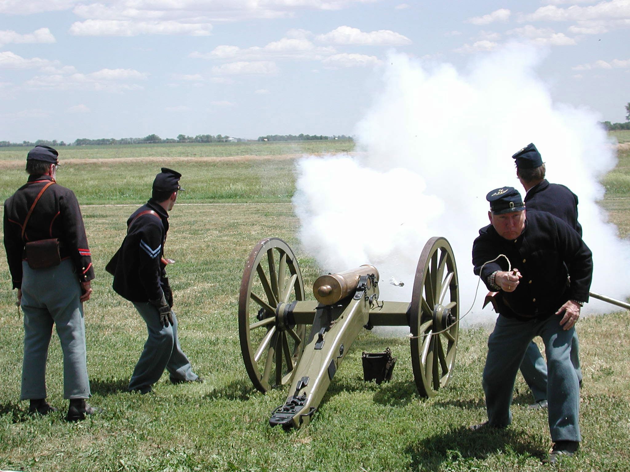 Volunteers demonstrating the use of a mountain howitzer during one of Fort Larned's living history weekends.