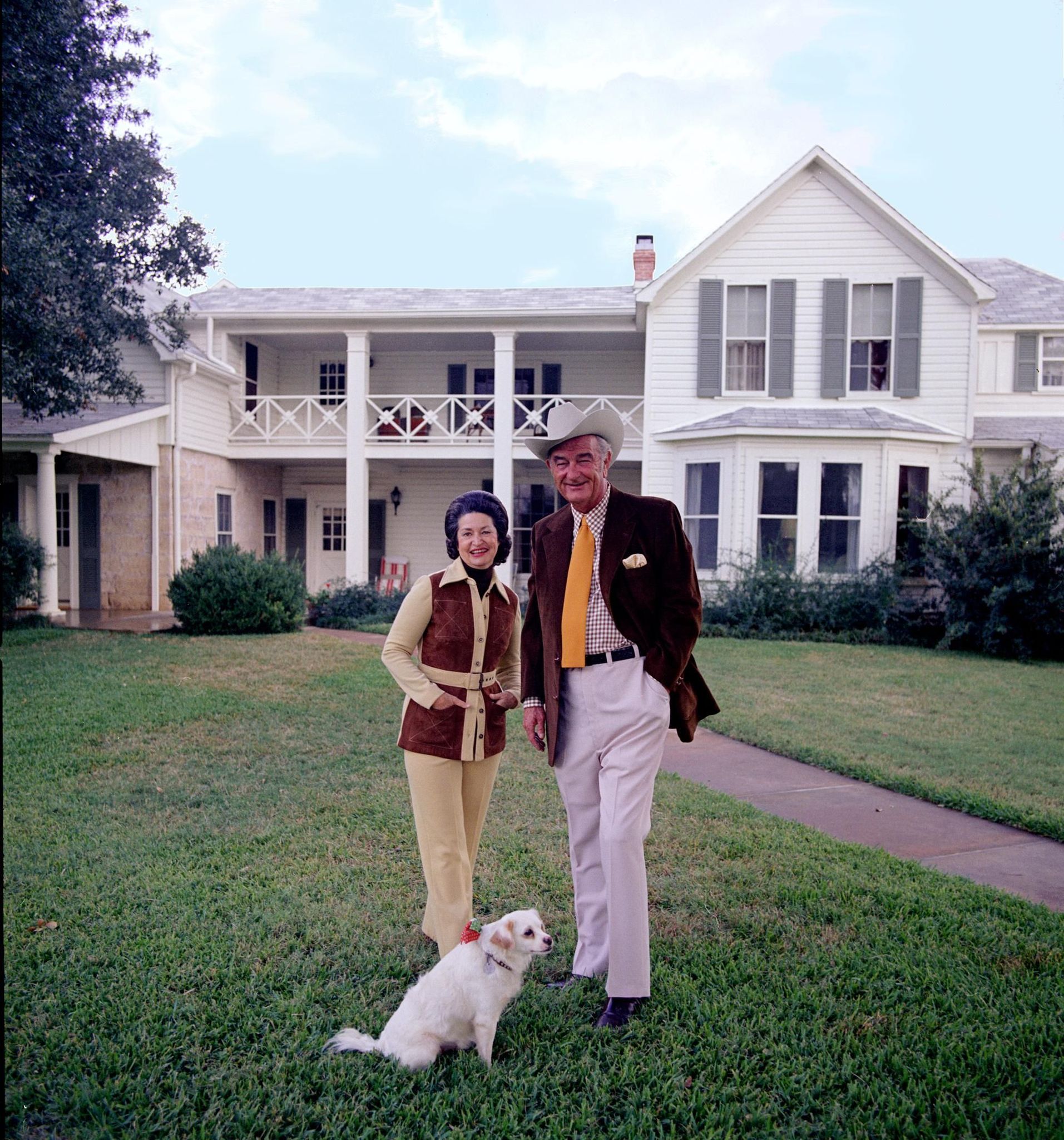 The Johnsons pose with their dog Yuki in front of the Texas White House. This was one of several photos from which they would choose for their 1972 Christmas card.