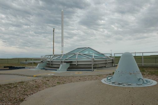 The glass enclosure allows visitors to view a Minuteman II missile in the silo.