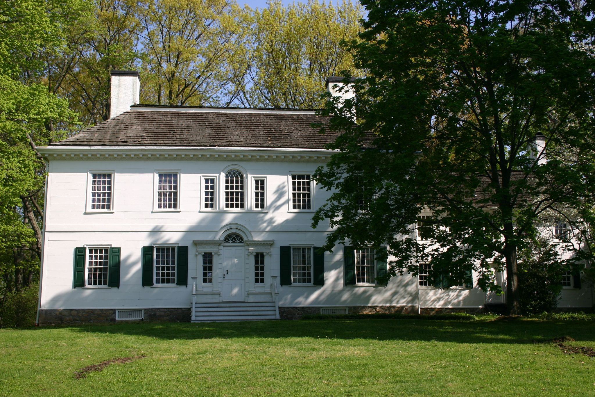 The front facade of the Ford Mansion in summer.