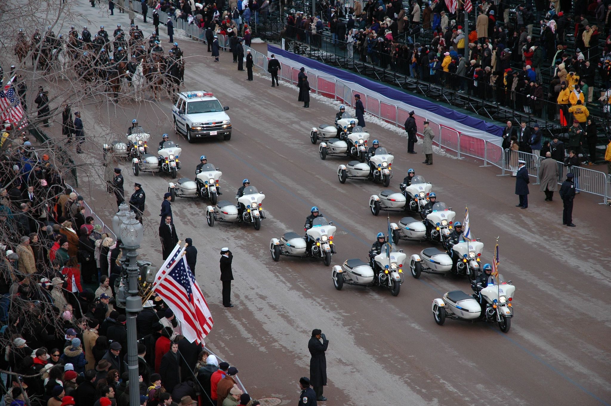 Police motorcycles pass in formation during the 2013 inaugural parade.