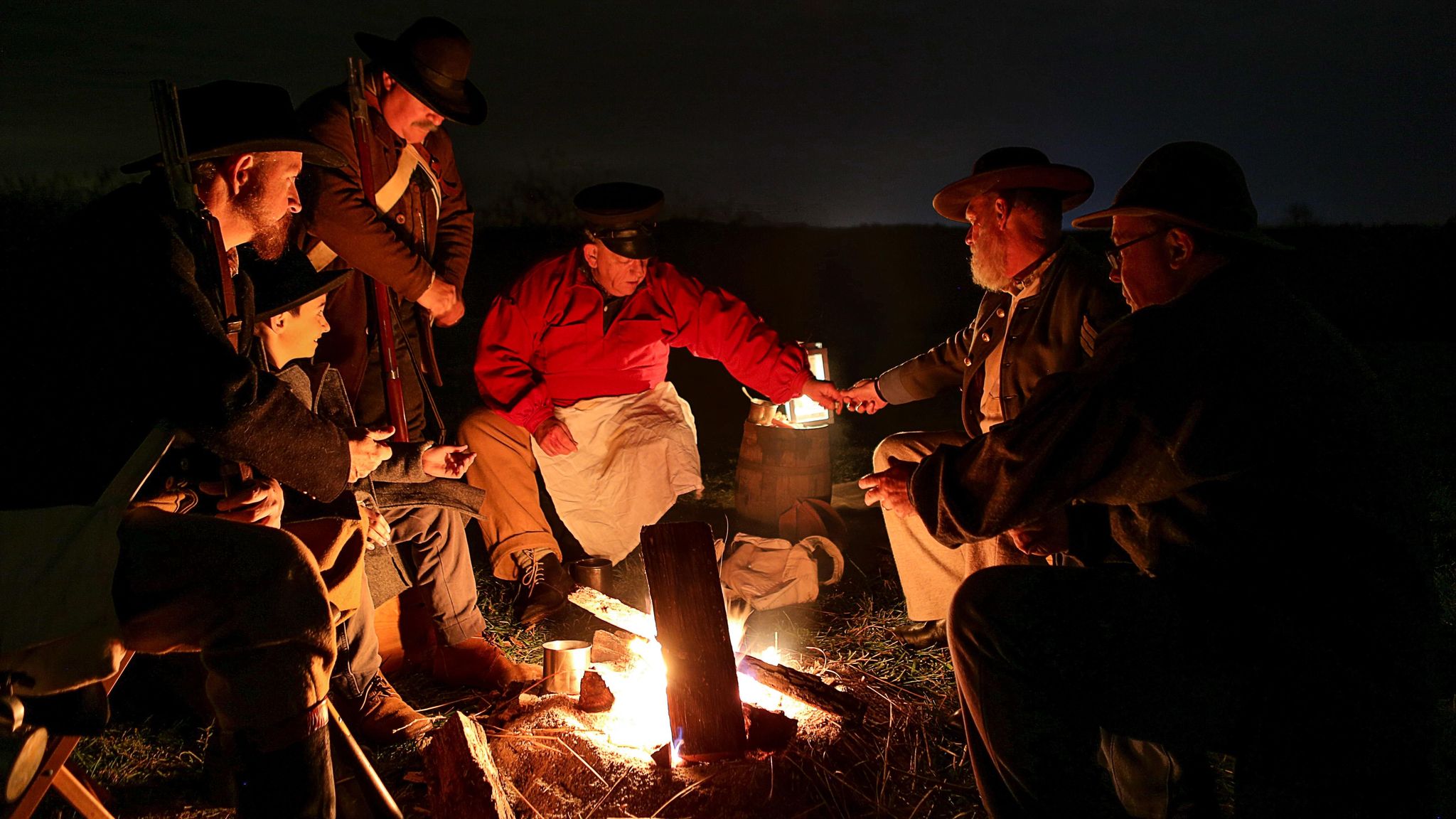 Living history volunteers act out a scene during the annual Moonlight Tours event
