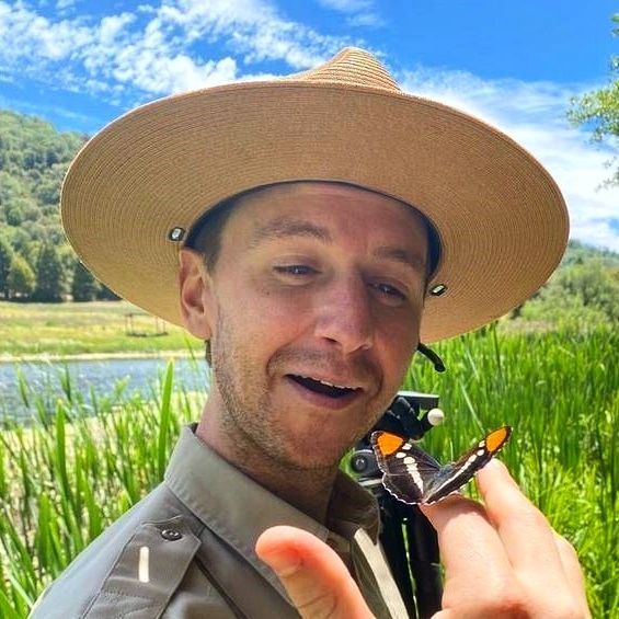 Park Interpretive Specialist Will Meyst with butterfly