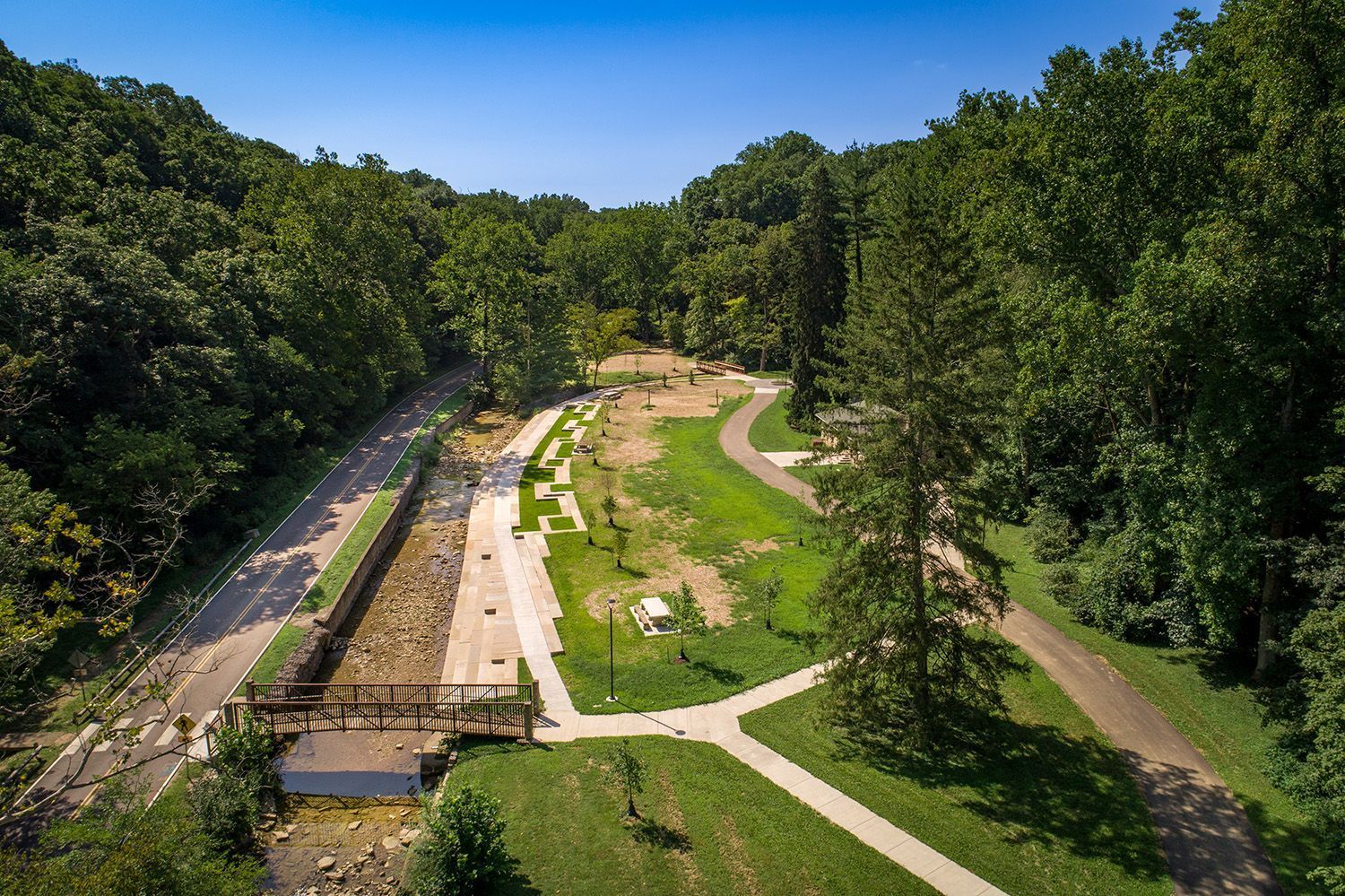 Aerial view of Cascade Creek and Lower Cascades Park looking south from pedestrian bridge.