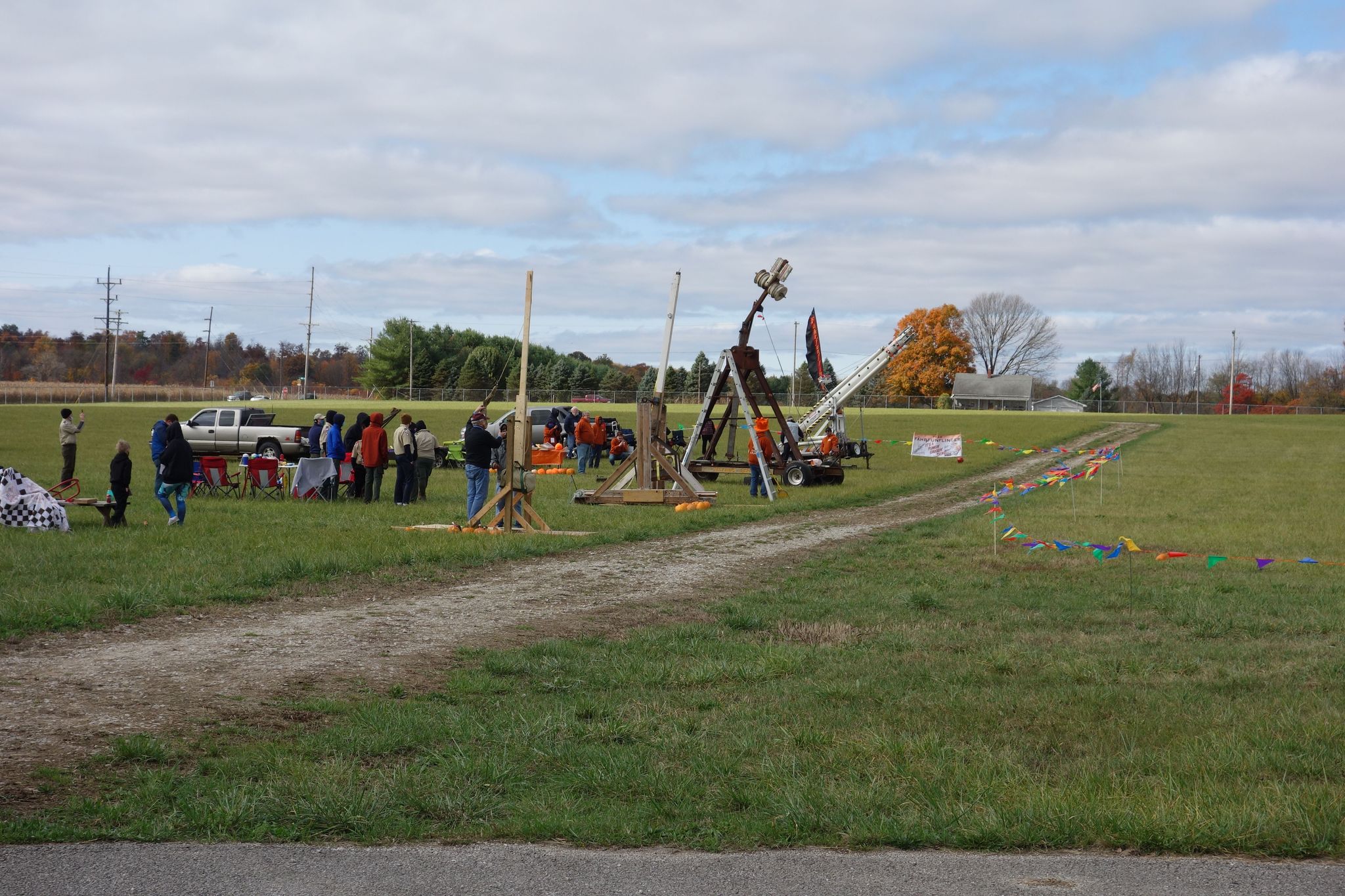 Launch devices set up in a row in field at Monroe County Fairgrounds during 2021 Pumpkin Launch