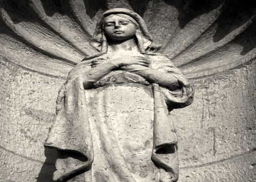 Mission Espiritu Santos: a carving on the stone wall in Goliad, Texas