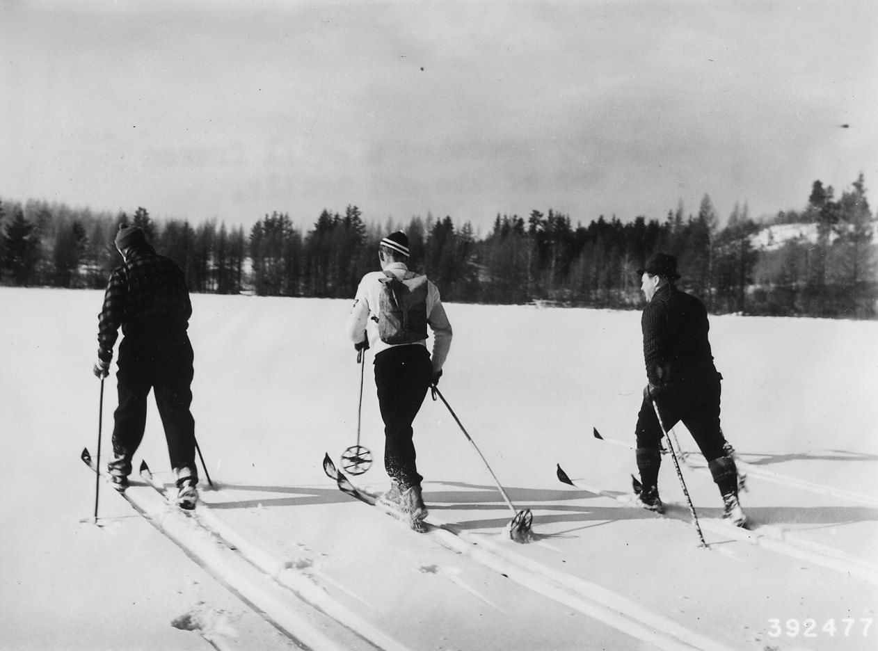 Vintage 1940 ski party crossing  a small frozen lake on one of the ski trails at Shingobee Winter Playground. Photo by Dept of Agriculture/wiki.