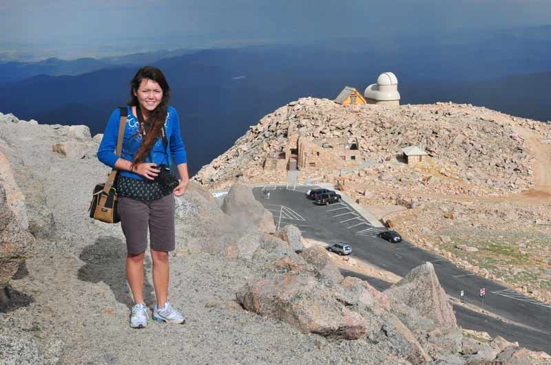 Young photographer on the Mt. Evans NRT summit trail, with the parking area below; Photo by Kim Schmidt