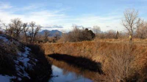 THE TRAIL ALONG THE FARMERS HIGH LINE CANAL, WHICH DIVIDES THE REFUGE INTO ITS TWO MAJOR AREAS