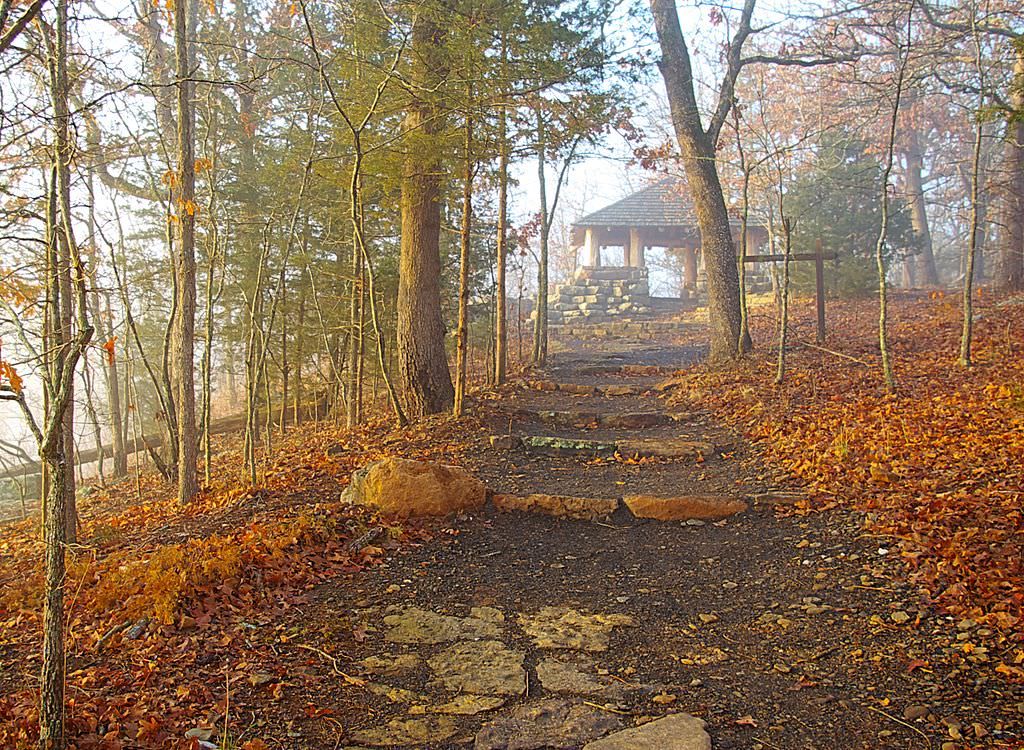 The CCC overlook at the top end of the Yellow Rock Trail in Devil's Den State Park, Arkansas, viewed through light fog moments a. Photo by Sam Wilson.