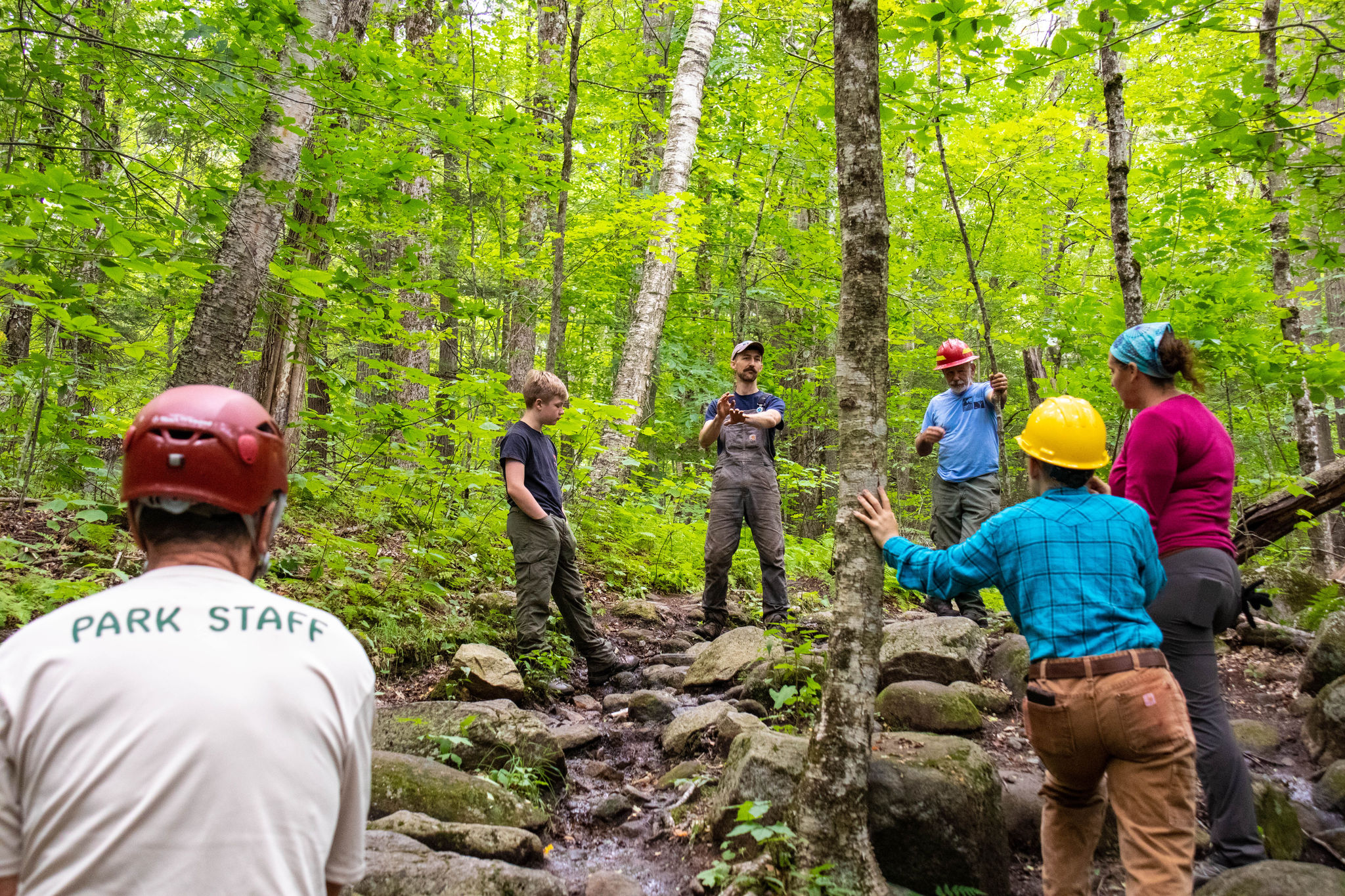 Andy Crowley explains the work a trail crew will be doing on a rocky trail on Mt Monadnock during a previous MTW.
