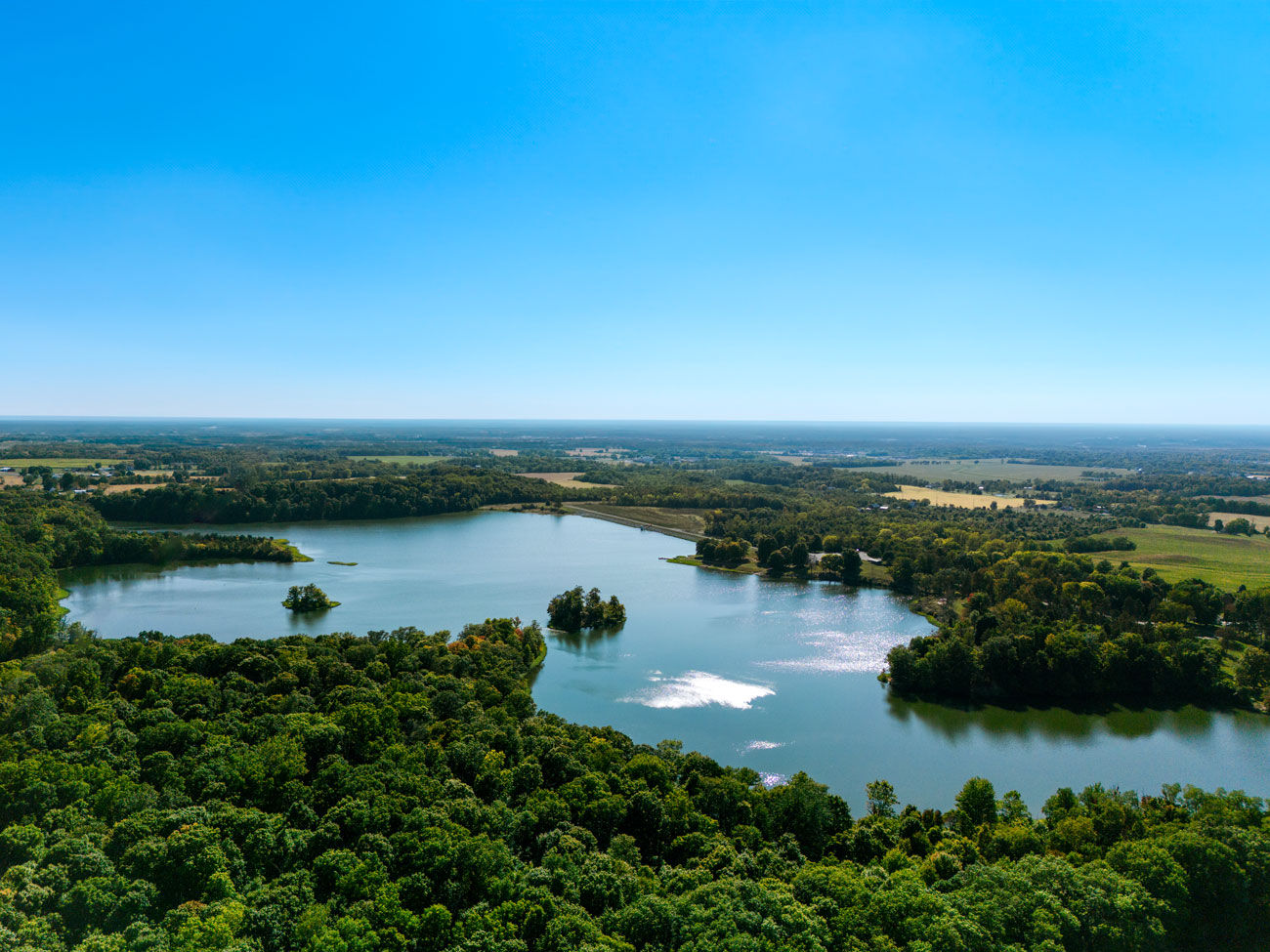 aerial view of AW Marion lake with a stunning blue sky on a summer day