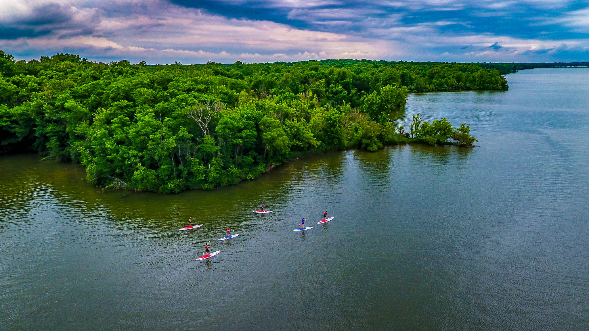 aerial view of Alum Creek Lake with dramtic sky and paddlers in the water