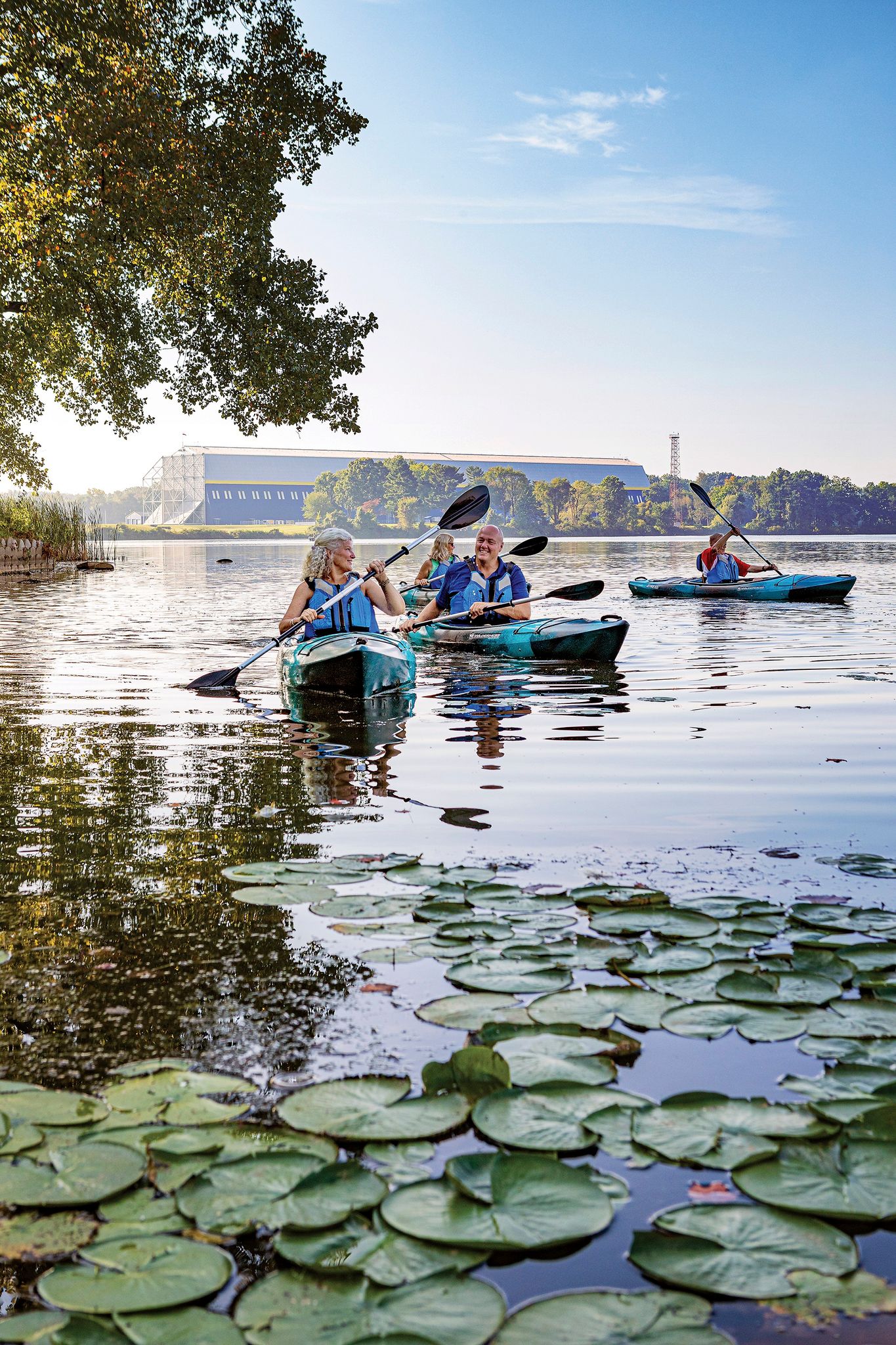 family kayaking on wingfoot lake on a sunny day