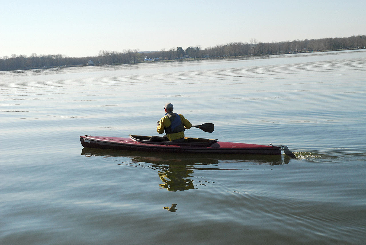 A person in a canoe on a lake at Buckeye Lake State Park.