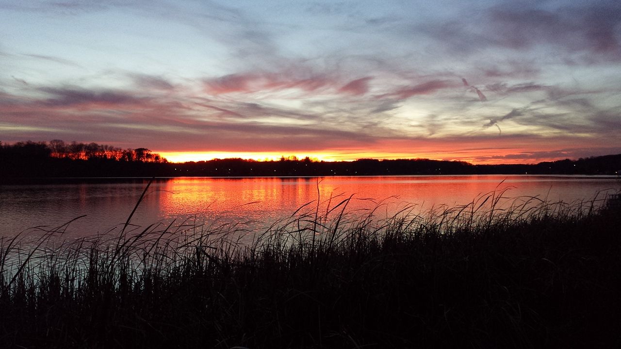 A sunset over a body of water at Guilford Lake State Park