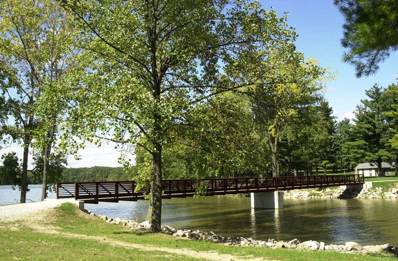 Bridge over a body of water with trees at Harrison Lake State Park