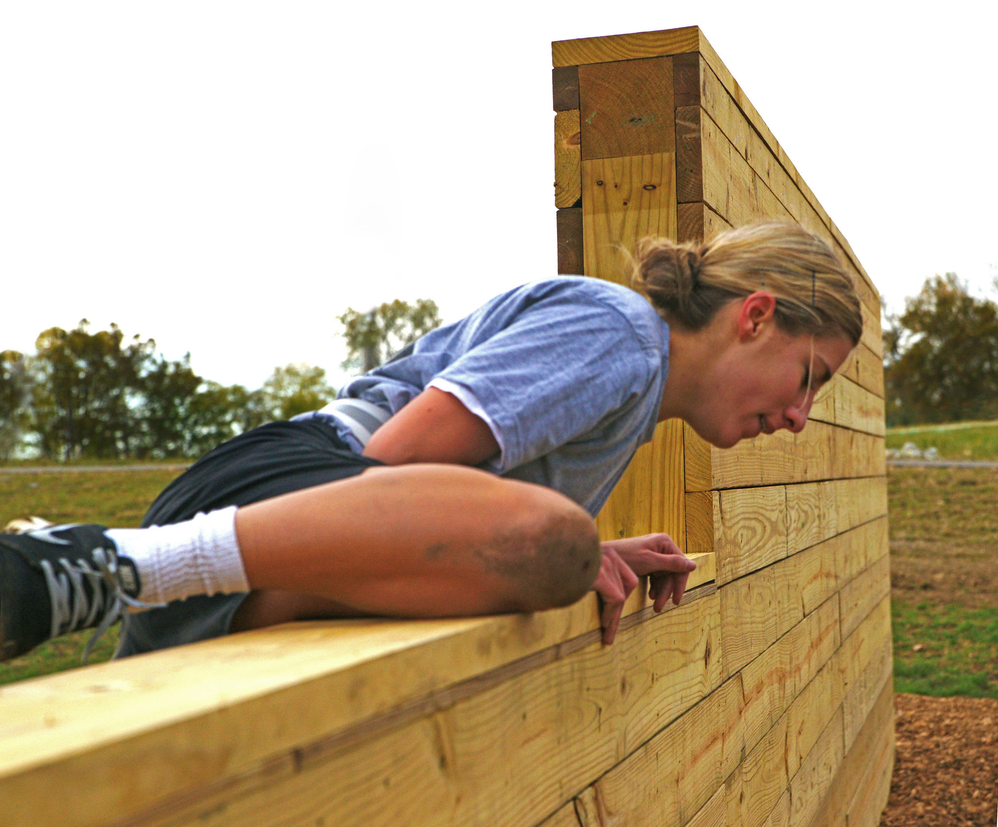 Competitor climbs over the wall on the Columbus Rotary obstacle course at Scioto Audubon Metro Park. Nov 13, 2013.