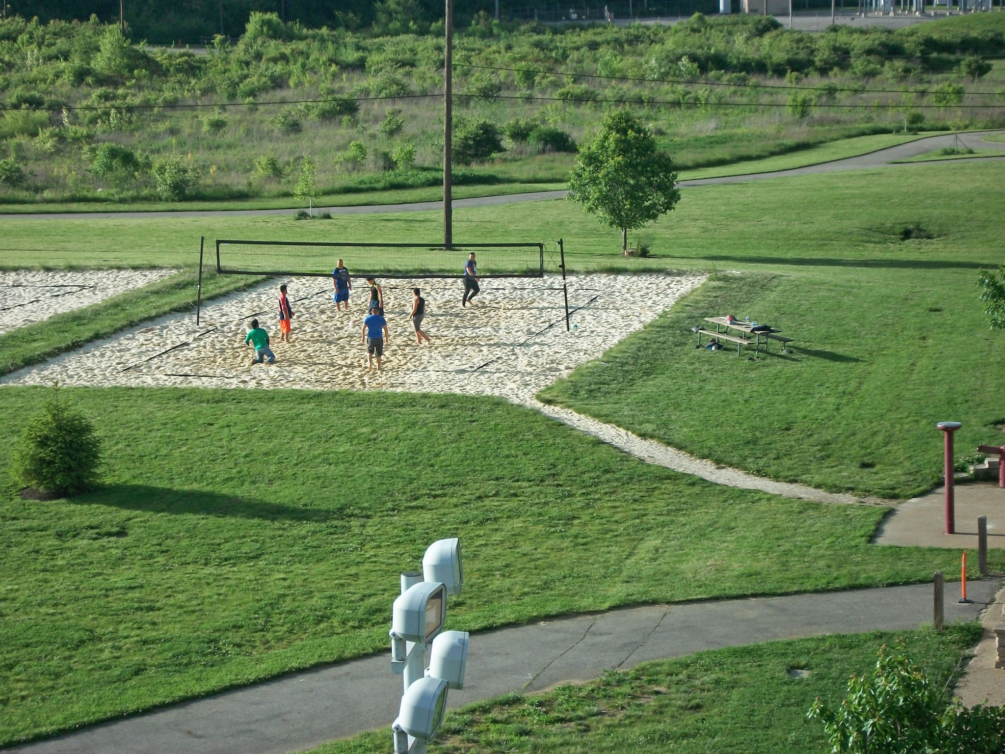 Teams on the sand volleyball court at Scioto Audubon