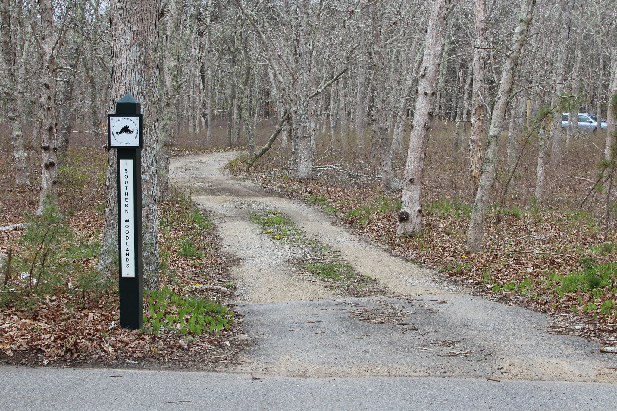 sign by bike path on County Road