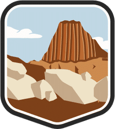 An illustrated badge for the Wyoming community showing a big rock formation and a clear blue sky.